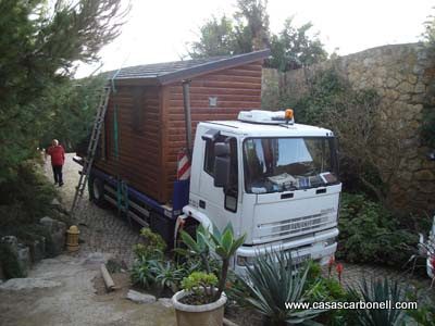 Casas transportables de madera, casas de madera antes de la descarga