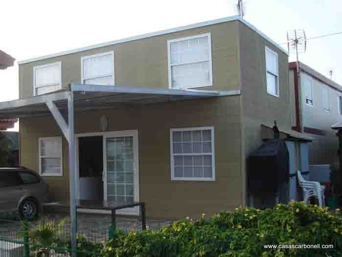 Casas modulares de ocasión con terraza en color verde